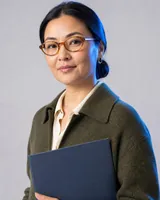 Portrait of Aigerim, the fictional persona of the Competitor Analyst, an AI agent