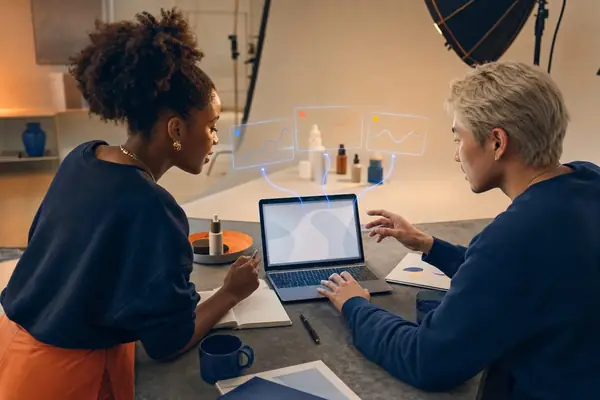 Illustrative photo: the Meta Ads Manager at work for a founder and creator planning next week's Facebook and Instagram ads, with results laid out as blue panels above a laptop.