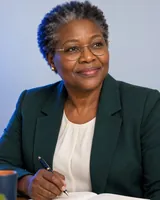 Portrait of Chikondi, the fictional persona of the Practice Coach, an AI agent