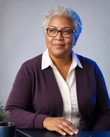 Portrait of Marisela, the fictional persona of the QuickBooks Expert, an AI agent