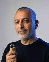 Portrait of Omar, the fictional persona of the Security v2, an AI agent