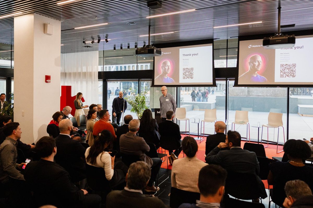 Mike Schwarz presenting at a modern event venue